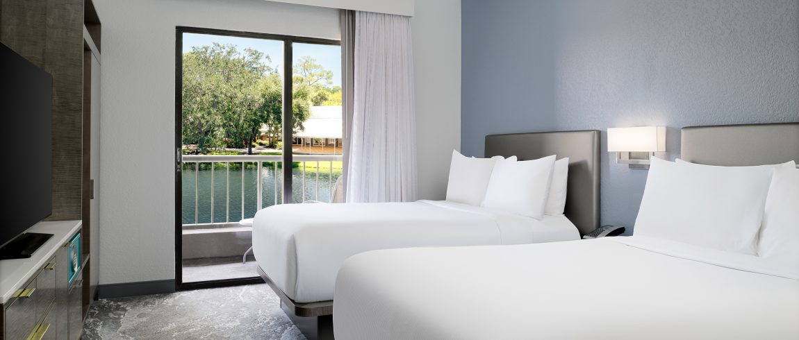 Two double beds looking out over the water