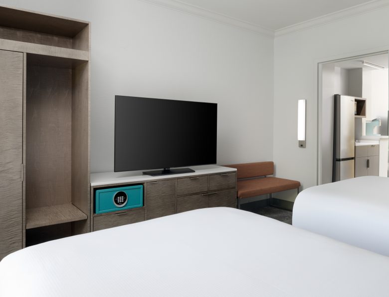 Two double beds facing the television set