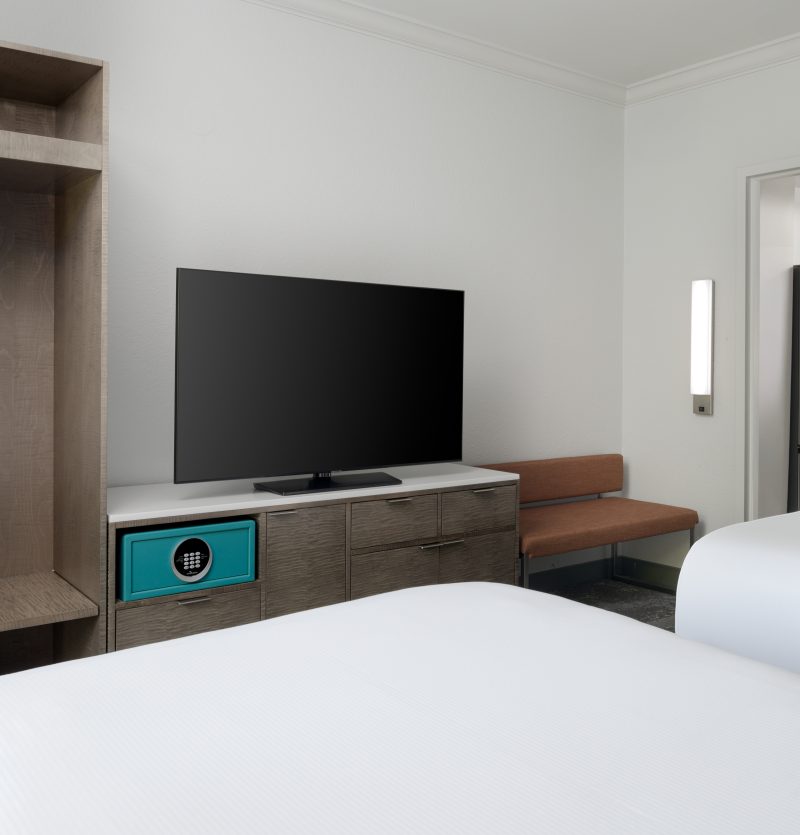 Two double beds facing the television set