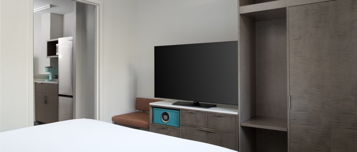 King Standard Suite Bedroom King bed facing the television