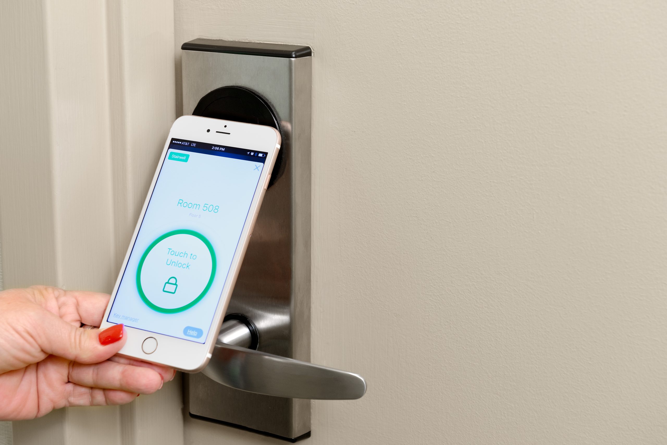 Digital Key A guest using their phone as a digital key on their door